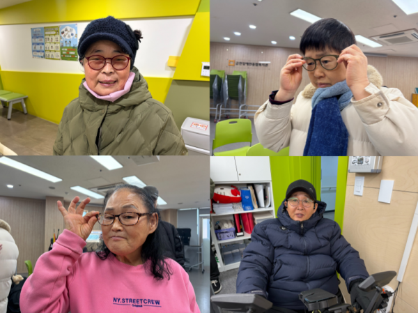 새롭게 맞춘 안경을 착용해보는 사진