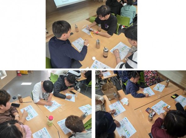인권교육 중 개별 활동지를 열심히 작성하고 있는 이용인들의 모습